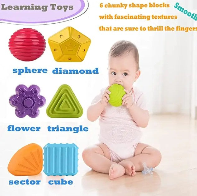 "Baby shape sorter cube with colorful sensory blocks"